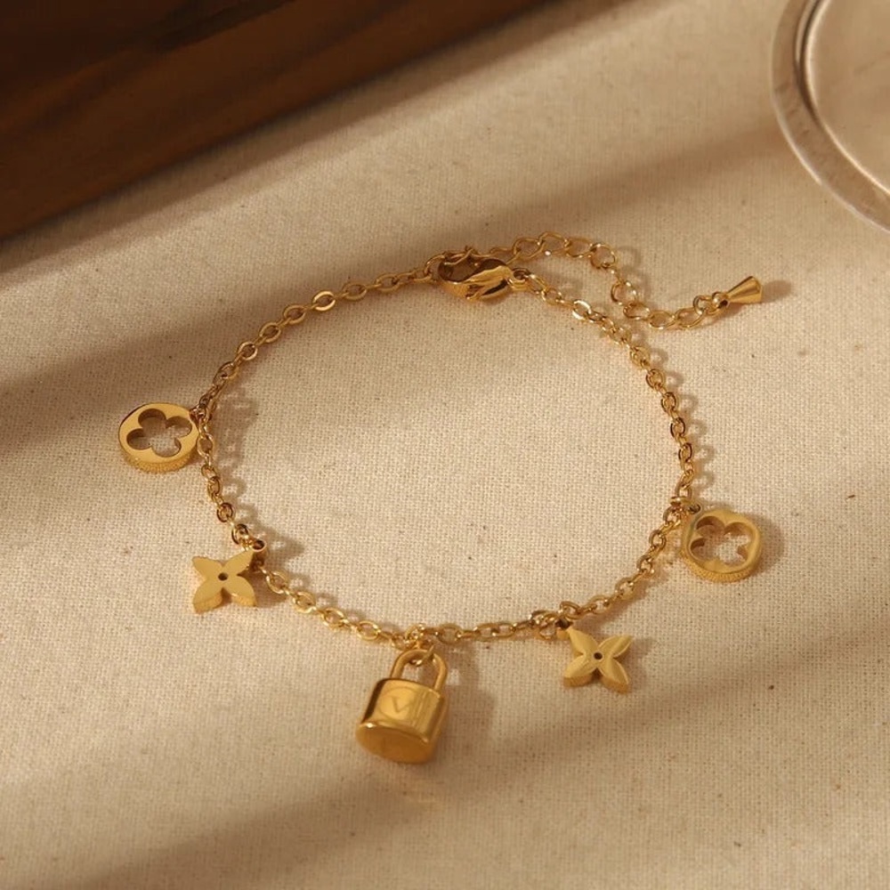 18K Gold Designer Charm Bracelet with Lock and Flower Accents - Picture 6 of 8